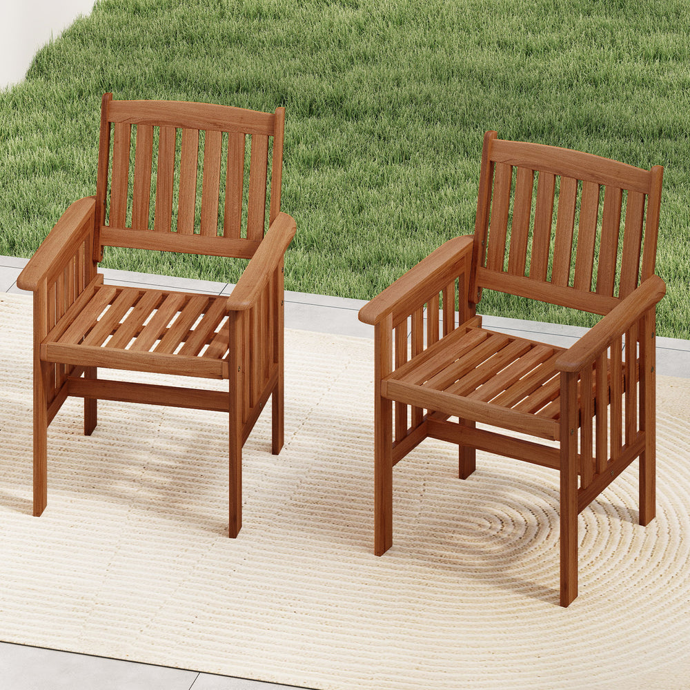 Set of 2 outdoor solid wood patio chairs with slatted seats and inclined backrests for backyard relaxation.
