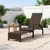 Patio chaise lounge with retractable ottoman, durable rattan, adjustable backrest, perfect for backyard relaxation.