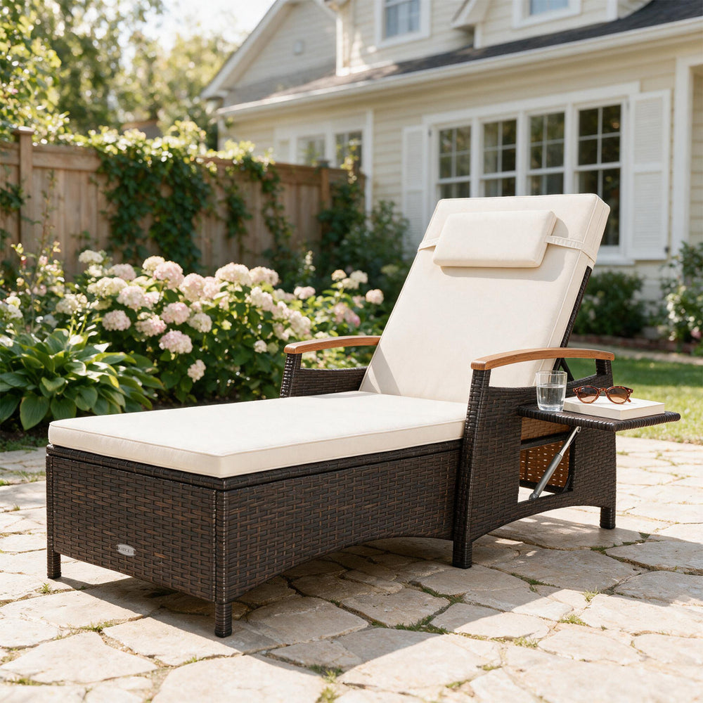 Patio chaise lounge with adjustable backrest, removable cushion, and side table for comfortable poolside relaxation.