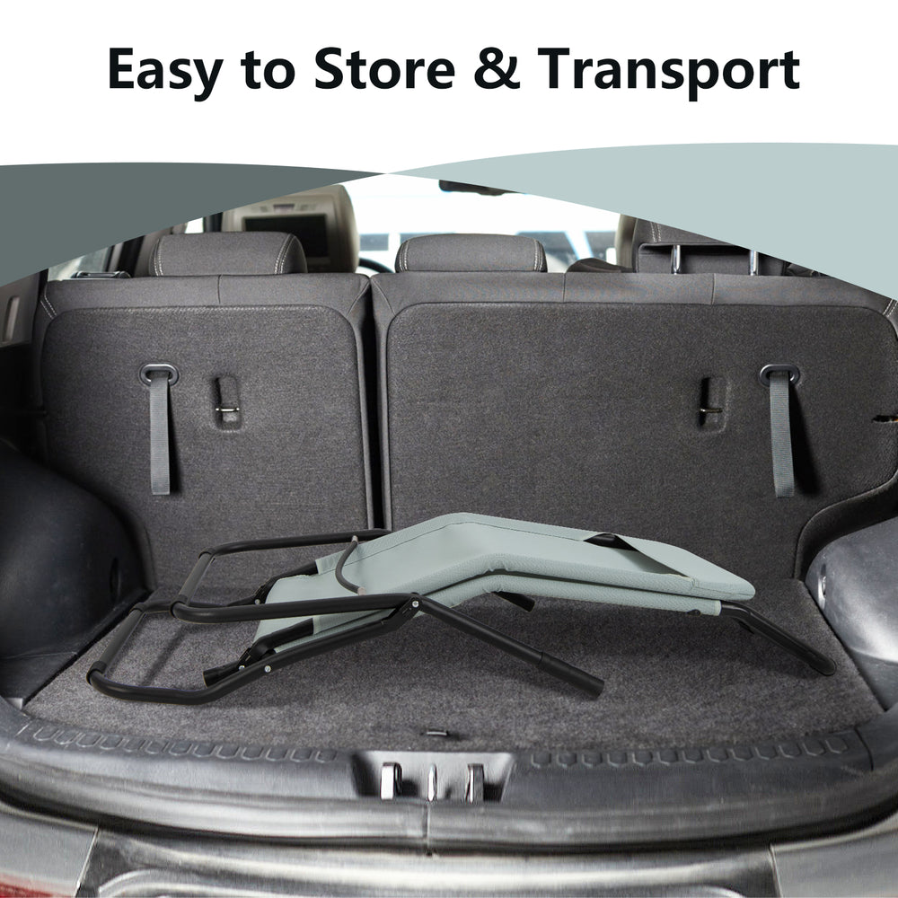 Folding light green patio chaise lounge in a car trunk, designed for easy transport and space-saving storage.