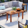 Patio coffee table with a natural wood finish, perfect for holding drinks and snacks during outdoor relaxation.