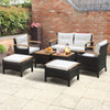 7-piece rattan patio sofa set featuring acacia wood tabletop and cushions, perfect for outdoor relaxation in any space.