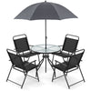 Patio dining set featuring a glass table, four folding chairs, and a 71" tilt umbrella for outdoor relaxation.
