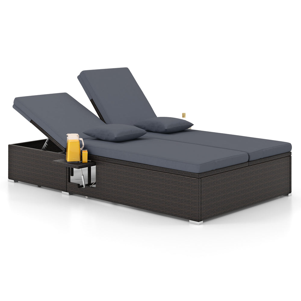 Gray patio double chaise lounge showcasing a rattan design, soft cushions, and independent backrest adjustments for.