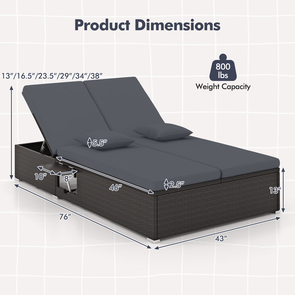 Patio double chaise lounge with gray cushions, adjustable backrests, and folding side trays for backyard relaxation.