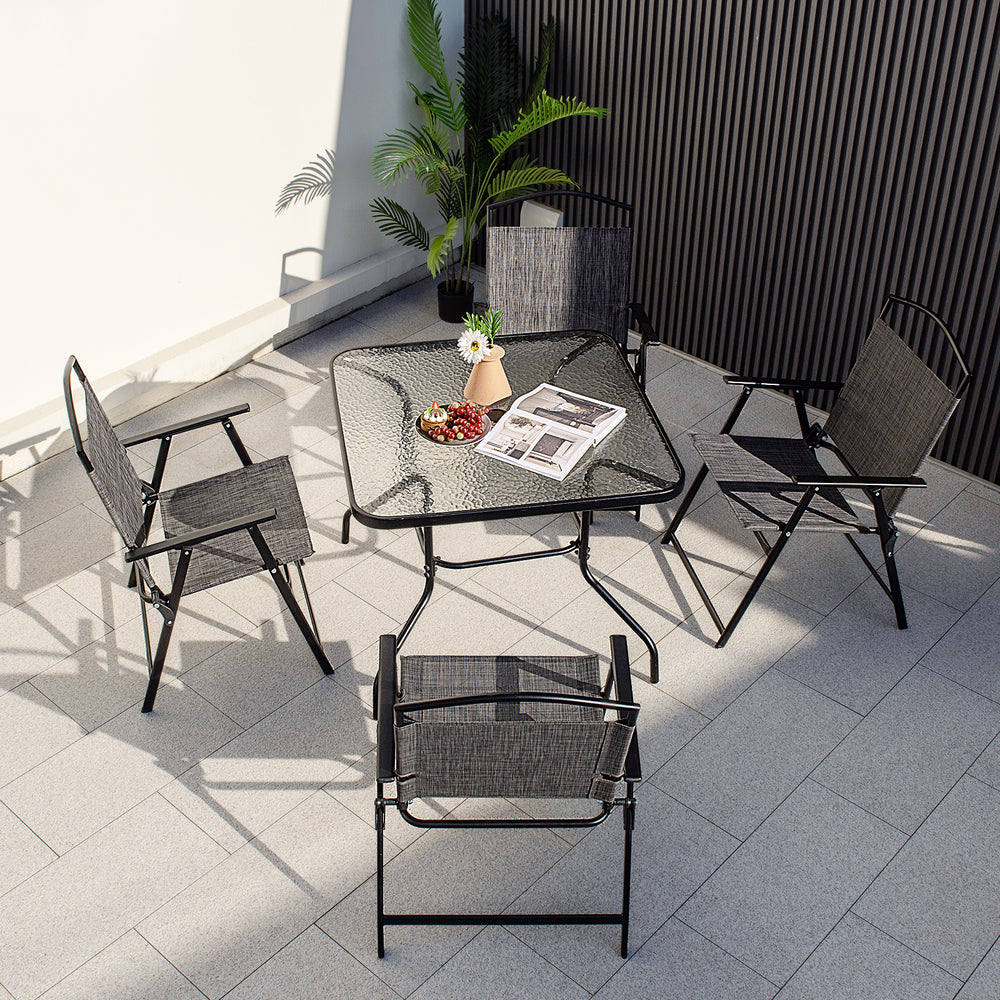 Patio folding chairs set of 4 in gray with cozy fabric and heavy-duty metal frame, ideal for backyard relaxation.