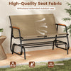 Patio glider bench for 2 with breathable fabric seat and curved teak armrests, perfect for backyard relaxation.