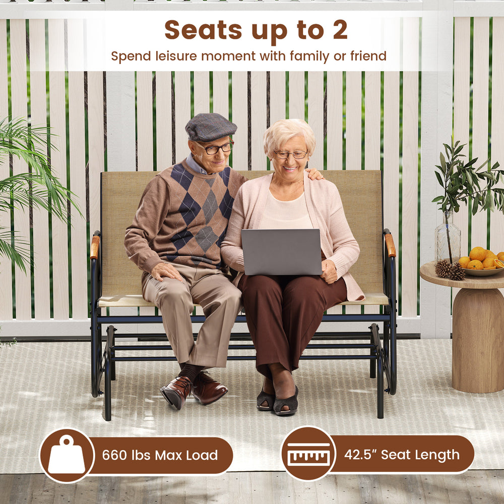 Patio glider bench for 2 with curved teak armrests, breathable fabric seat, and gentle gliding motion for outdoor.