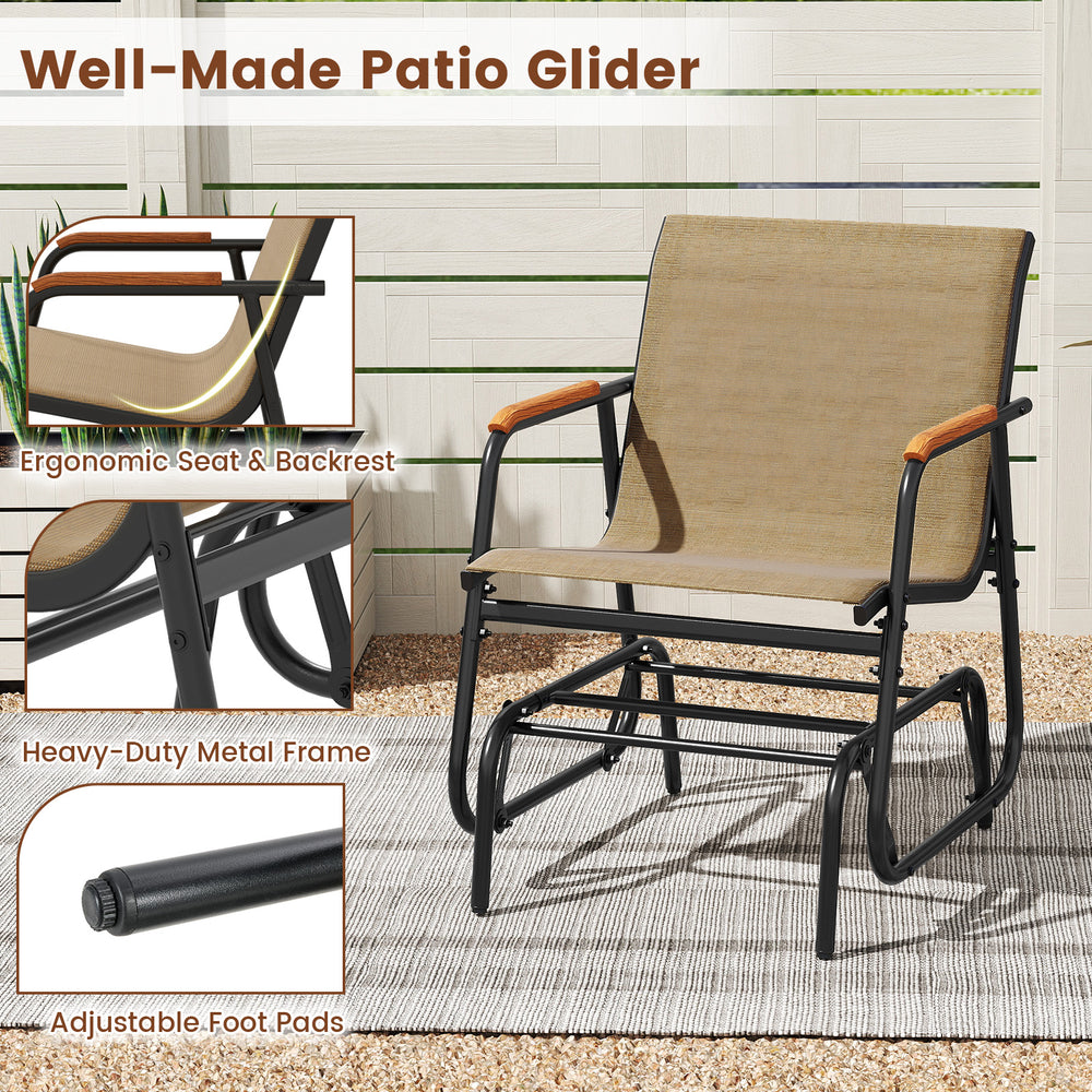 Patio glider chair with curved teak armrests and breathable fabric seat, perfect for backyard relaxation.