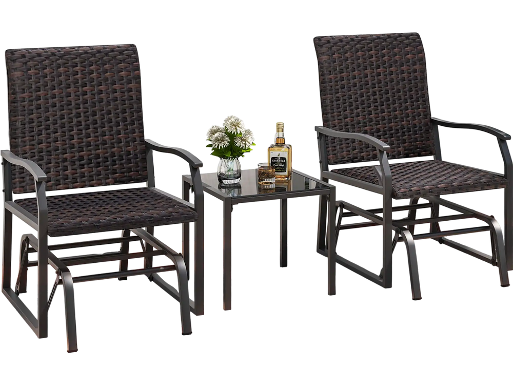 Two brown rattan gliding chairs with a tempered glass coffee table, perfect for backyard relaxation.
