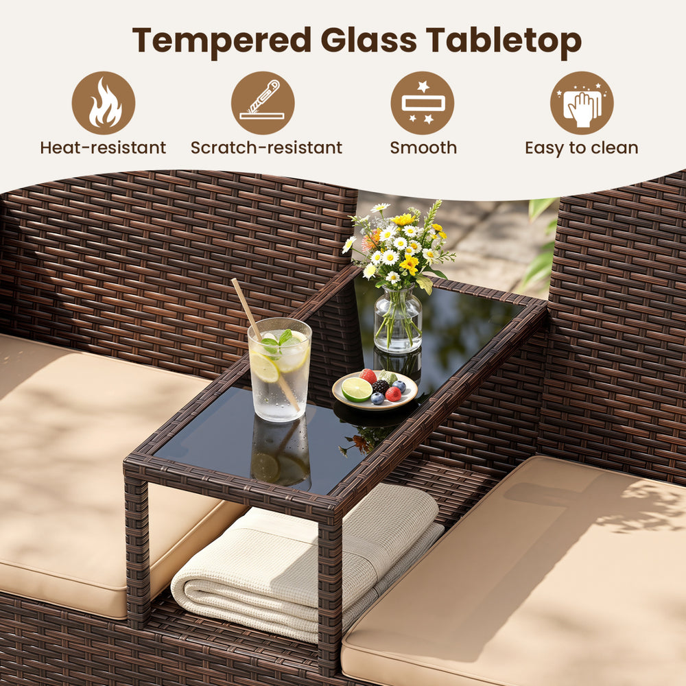 Tempered glass tabletop with a built-in coffee table on a brown wicker patio loveseat set for outdoor relaxation.
