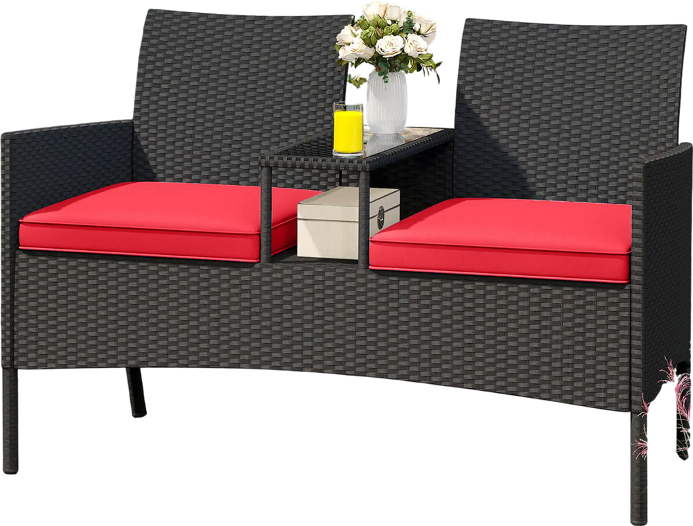Patio loveseat with integrated table, featuring a sturdy metal frame and zippered red cushions, ideal for outdoor.