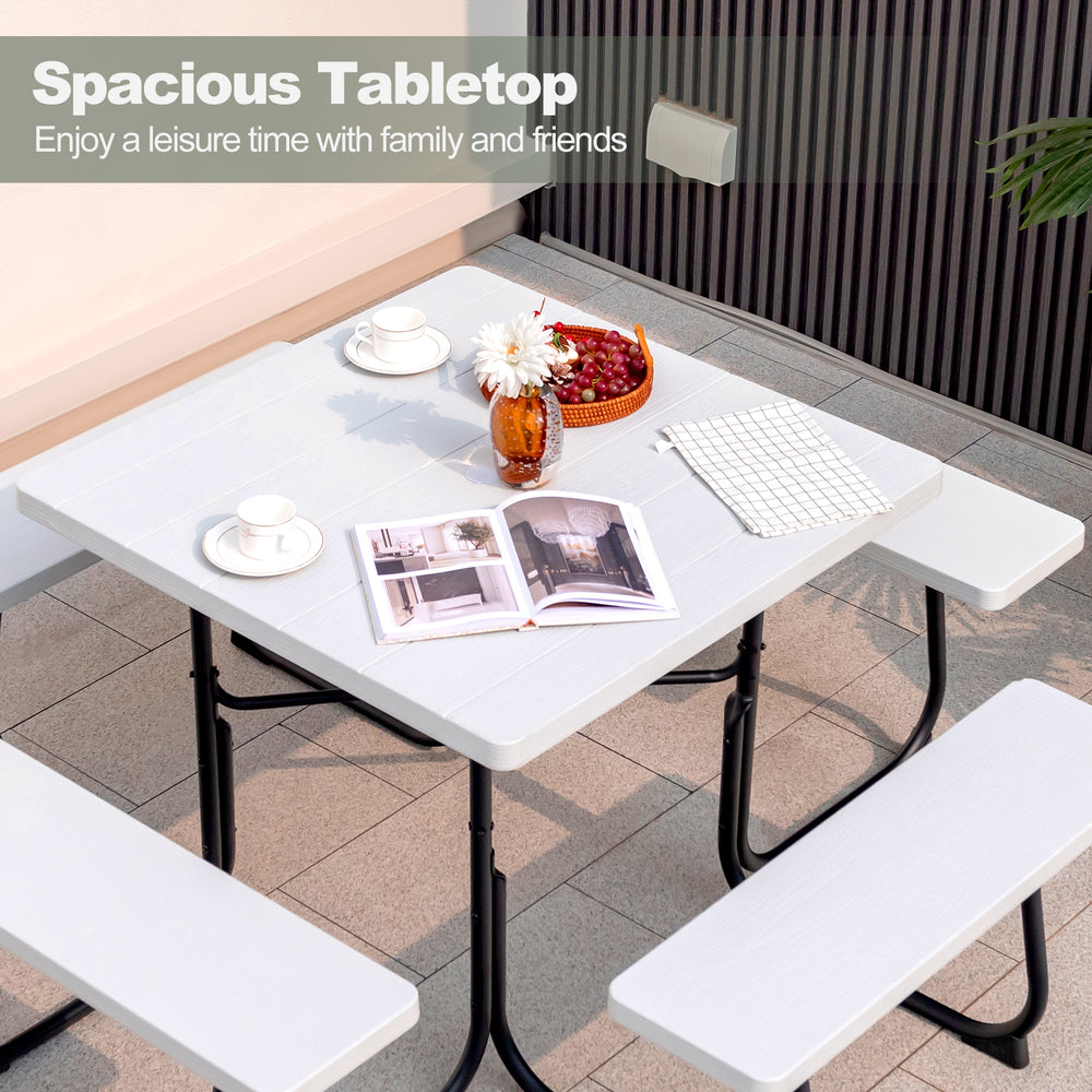 Outdoor picnic table with spacious white HDPE tabletop, four benches, and umbrella hole, perfect for family gatherings.
