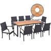 9-piece patio rattan dining set featuring an acacia wood table and 8 chairs with cushions, perfect for backyard.