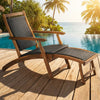 Patio rattan folding lounge chair with acacia wood frame and retractable footrest, perfect for poolside relaxation.