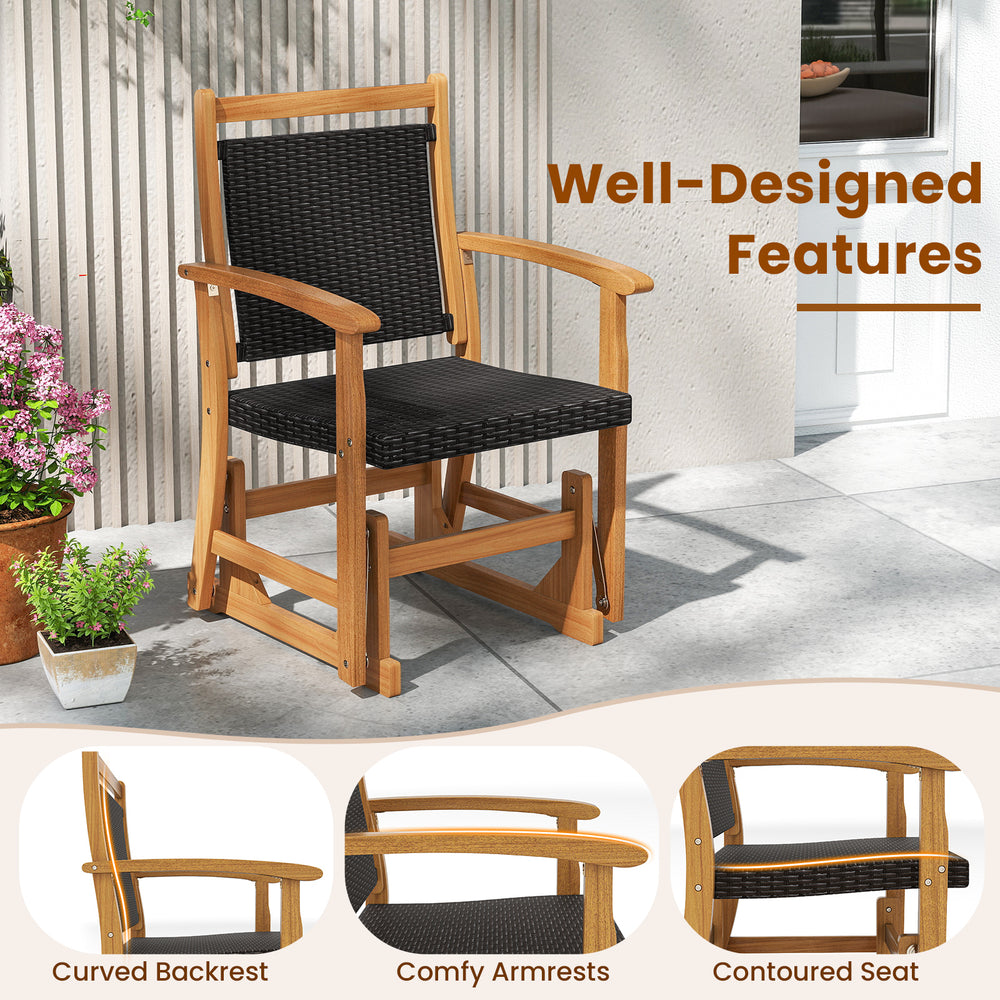 Patio rattan glider chair with acacia wood frame, featuring a wicker seat back and ergonomic design for backyard.