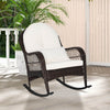 Patio rattan rocking chair with soft white cushions, ergonomic design, ideal for front porch or backyard relaxation.