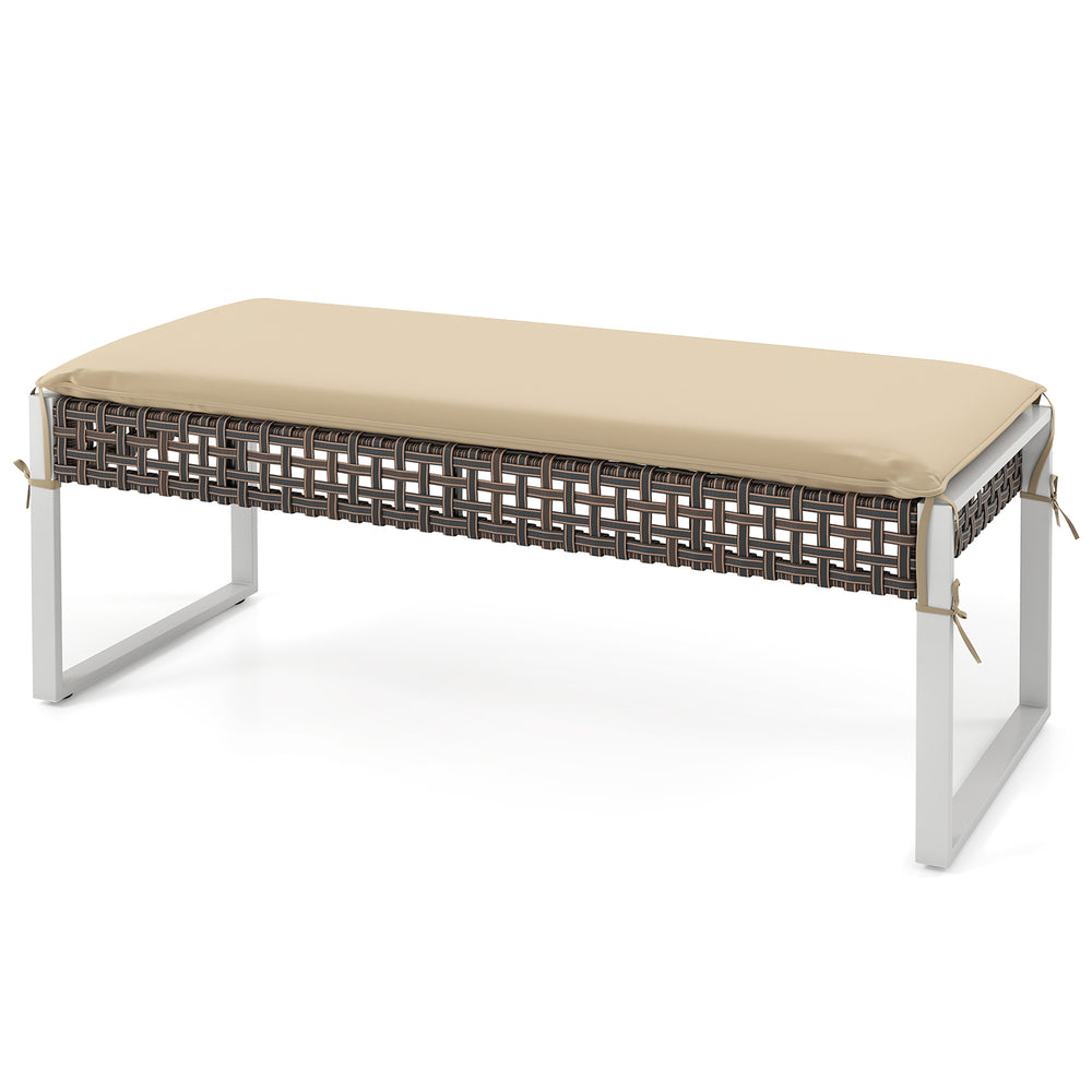 Rectangle patio ottoman with beige seat cushion, hand-woven PE rattan, and sturdy metal legs for versatile outdoor use.