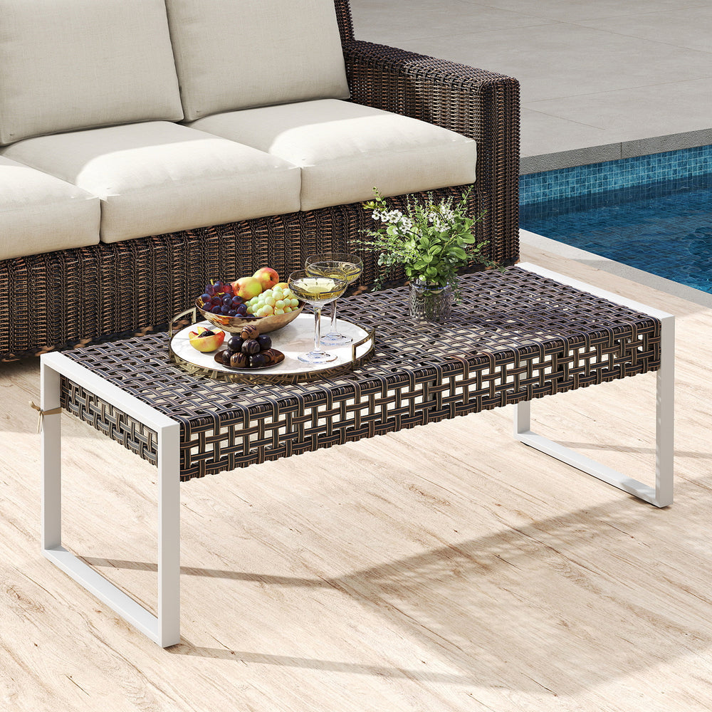 Rectangle patio ottoman with hand-woven PE rattan, beige cushion, and metal legs, ideal for outdoor relaxation.