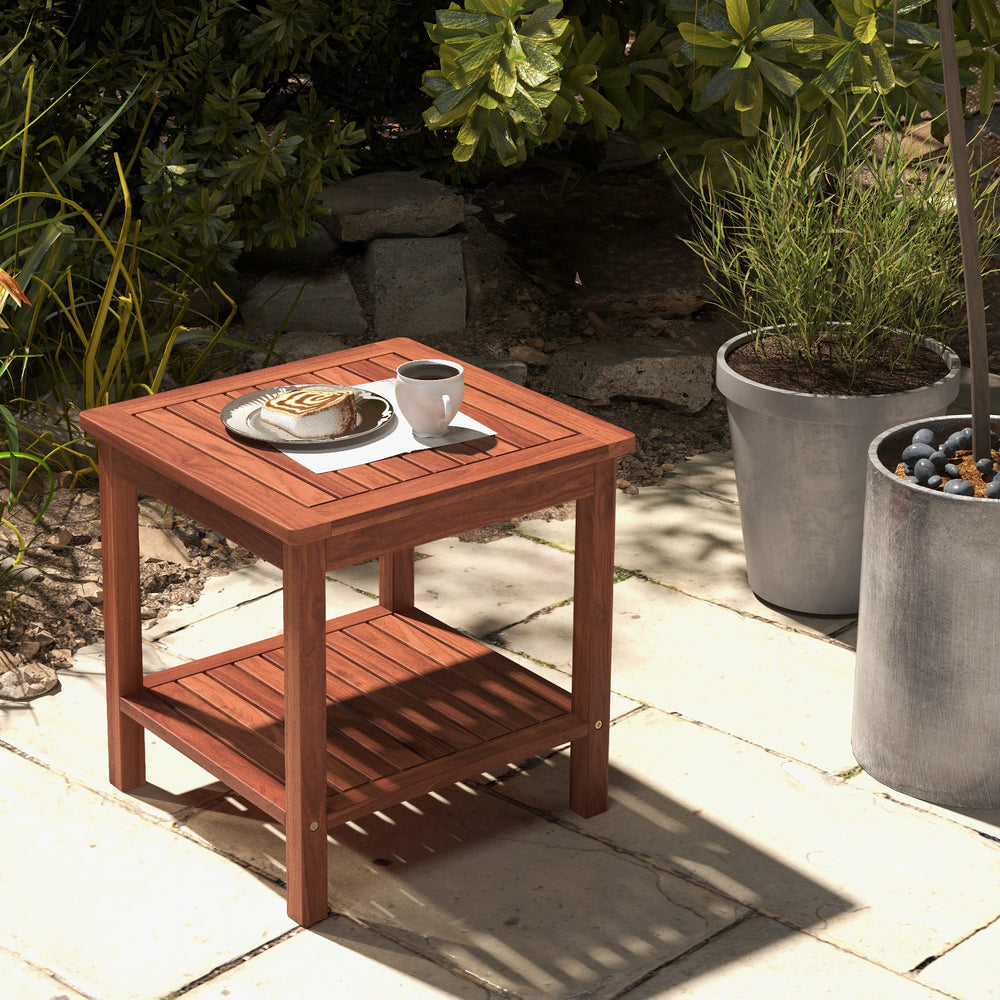 Acacia wood patio side table with slatted tabletop and shelf, perfect for backyard or poolside use.