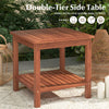 Double-tier acacia wood patio side table with slatted top and shelf, perfect for drinks and snacks by the poolside.