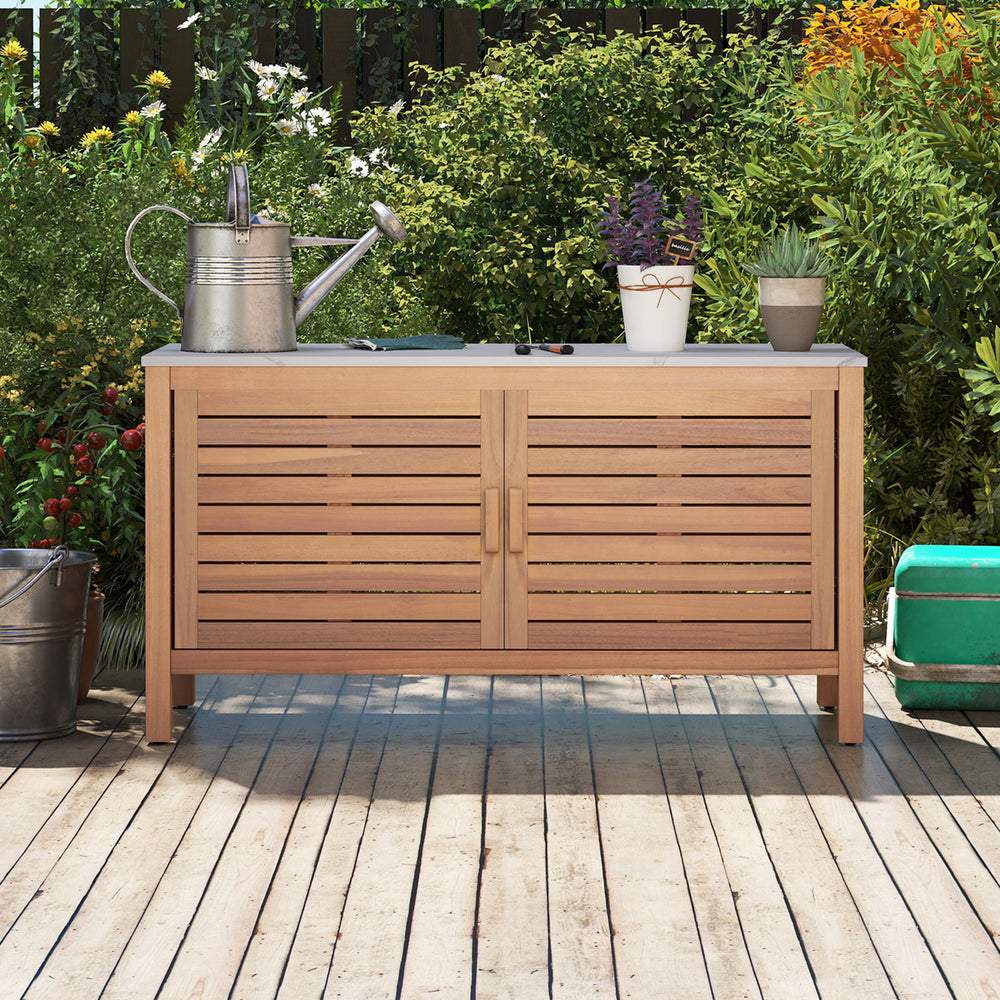 Faux marble tabletop of the patio storage cabinet complements the solid acacia wood, enhancing outdoor aesthetic appeal.