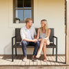 Brown rattan loveseat with soft sponge seat, perfect for cozy outdoor relaxation on patio or garden.