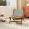 Mid-century accent chair with teak wood frame and nylon webbing seat, ideal for stylish indoor or outdoor use.