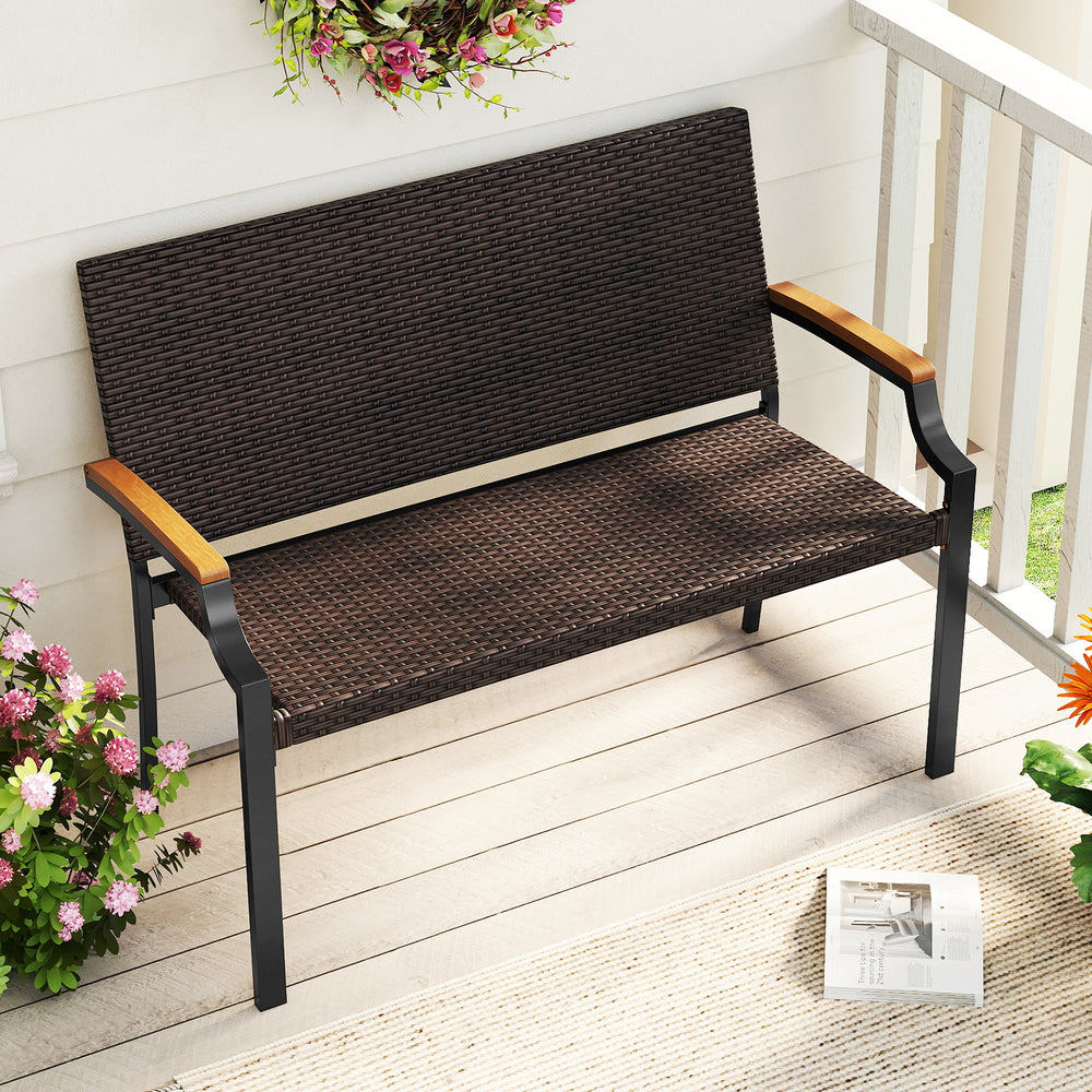 Patio wicker loveseat chair with acacia wood armrests and metal frame, perfect for backyard or garden relaxation.