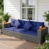 Navy blue patio wicker sectional sofa set with acacia wood armrests, perfect for outdoor relaxation in the garden.