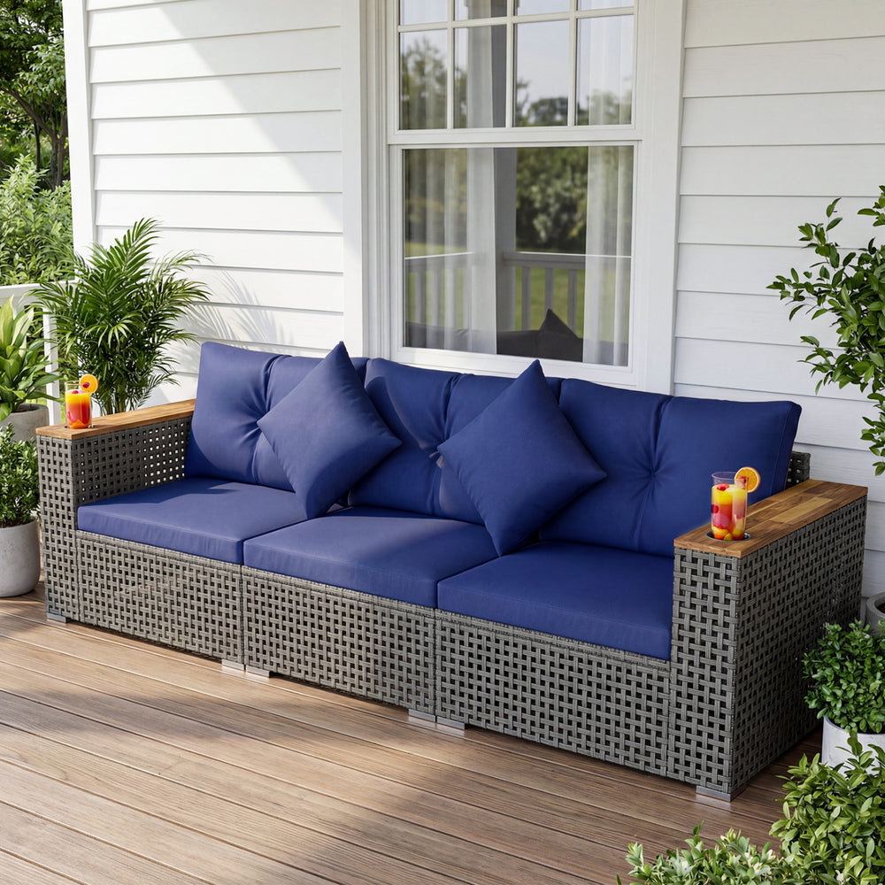 Navy blue patio wicker sectional sofa set with acacia wood armrests, perfect for outdoor relaxation in the garden.