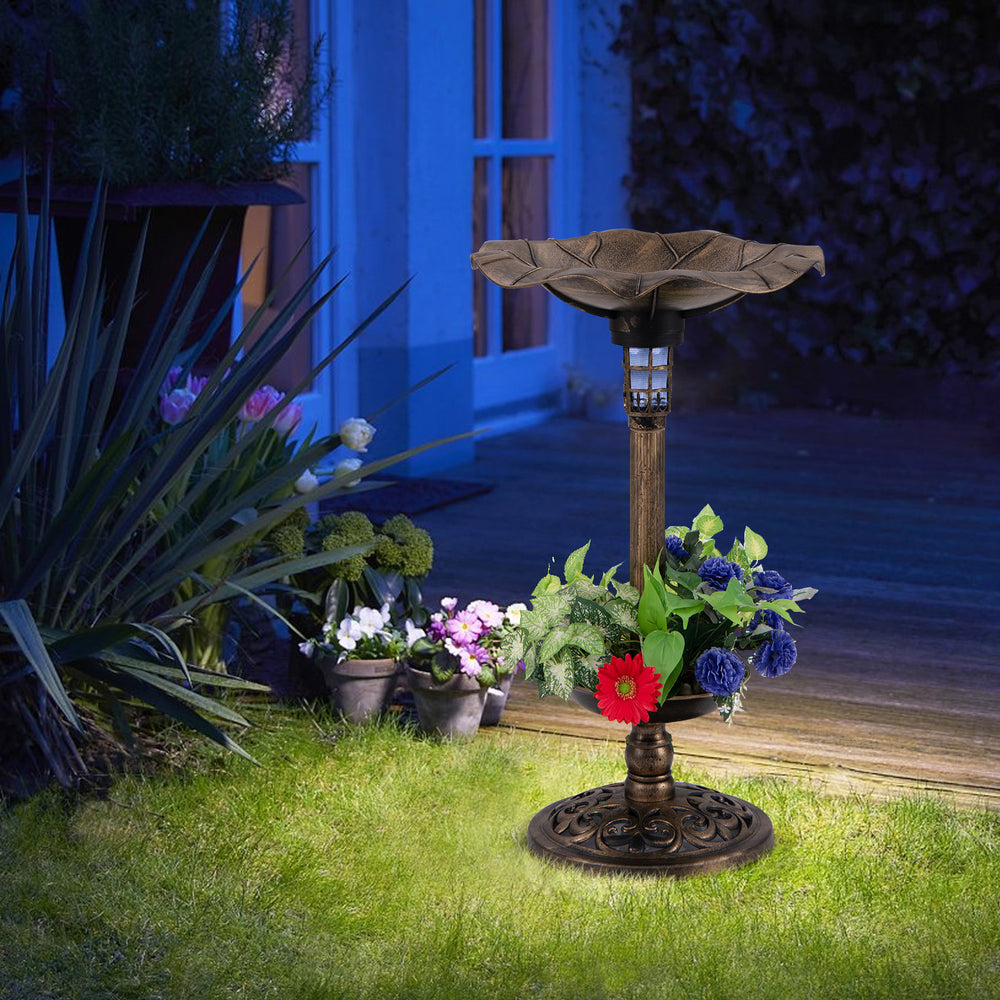 Standing pedestal birdbath and feeder combo with lotus leaf bowl in bronze, featuring a planter for healthy plants.