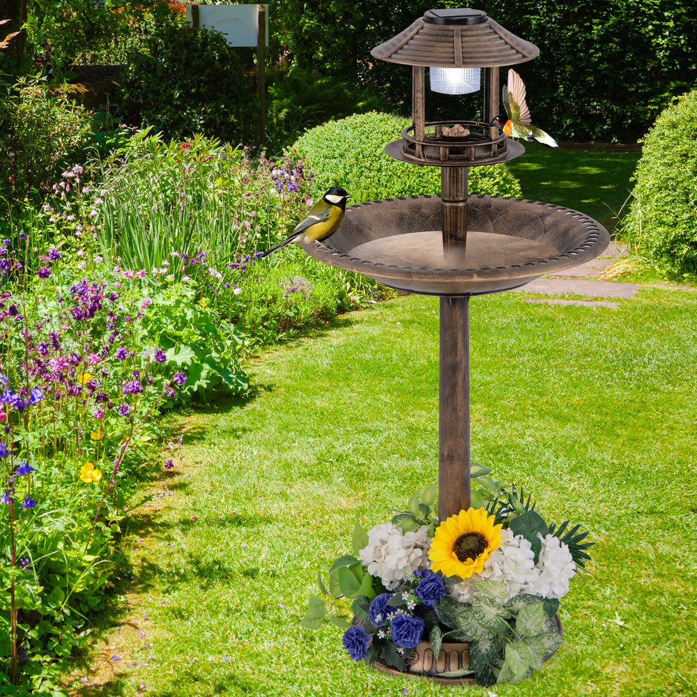 Pedestal bird bath with solar light, bird feeder, and flower planter in bronze, perfect for enhancing your garden.