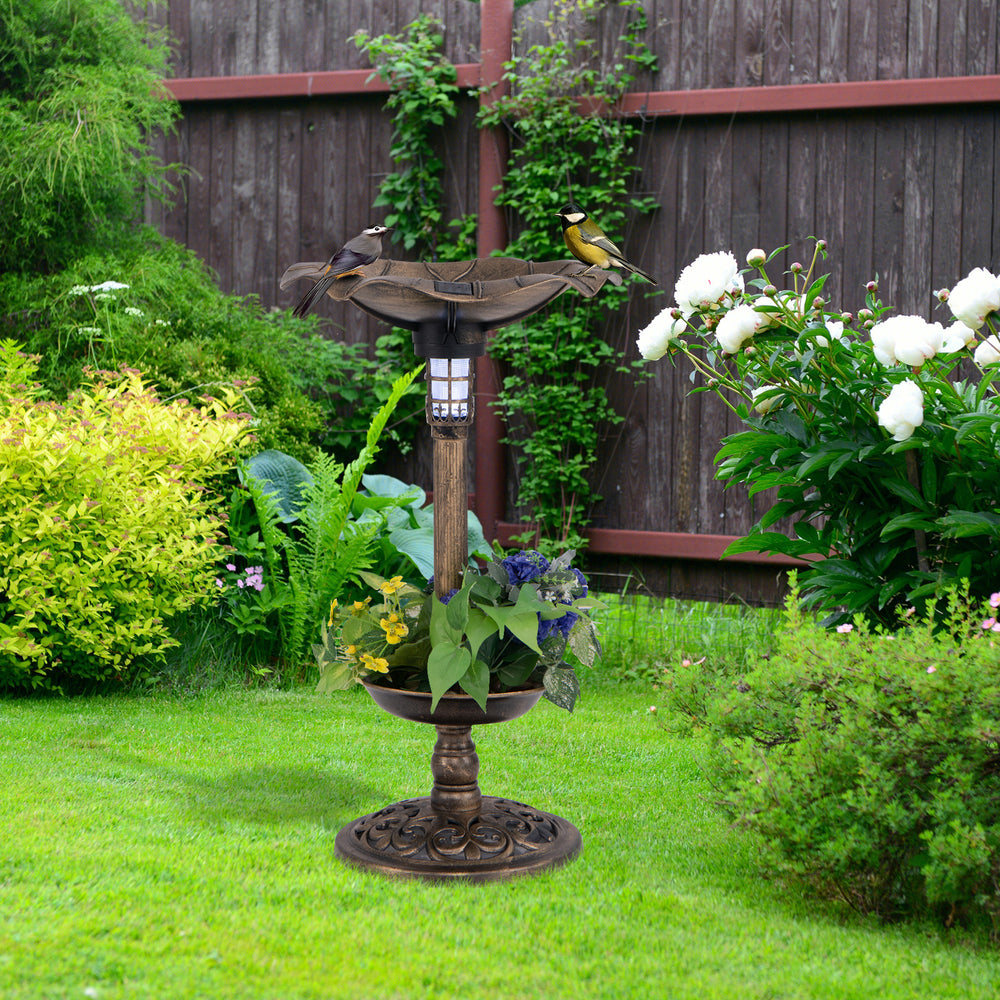 Standing pedestal birdbath and feeder combo in bronze with lotus leaf bowl, perfect for attracting birds in the garden.