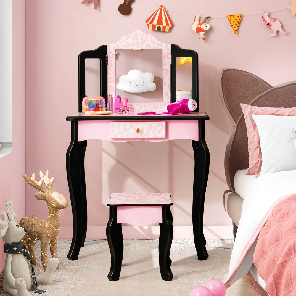 Kid vanity set with tri-folding mirror in pink and leopard print, perfect for makeup and dressing-up fun in a child's.