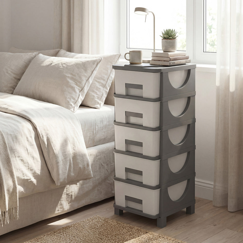 Gray plastic storage organizer with compact drawers, ideal as a bedside table for maximizing space and easy access.