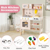 Height-adjustable pink play kitchen with dual stoves, microwave, and rich accessories for imaginative role-playing.