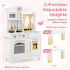 Play kitchen for kids with adjustable heights, featuring a microwave, sink, and realistic cookware for imaginative play.