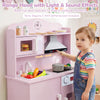 Wooden pink play kitchen set featuring a range hood with light and sound effects, microwave, and realistic cooking accessories.