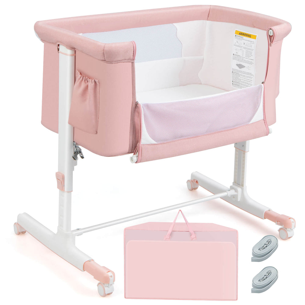 Portable pink bedside bassinet with adjustable height, breathable mesh, and travel bag for convenient baby care.