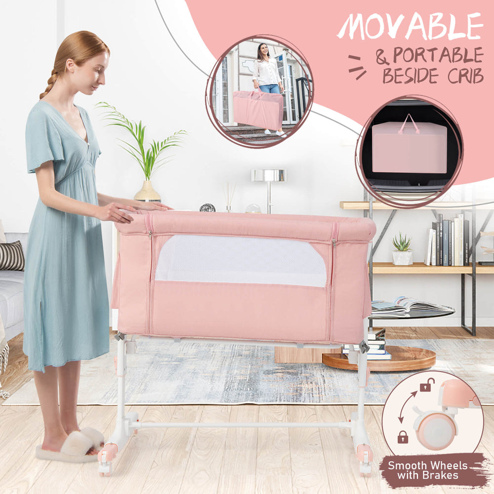 Portable pink baby bedside bassinet with adjustable height, breathable mesh sides, and lockable wheels for safety.