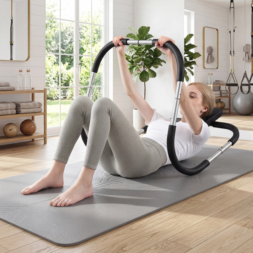 Portable AB trainer with headrest and foam handles, designed for stability and comfort during home or office workouts.