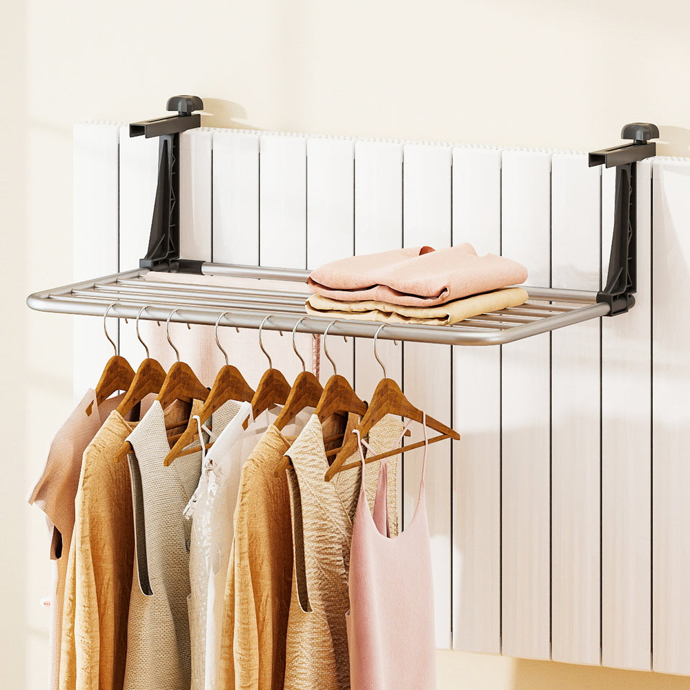 Portable aluminum clothes drying rack with adjustable brackets, featuring 7 bars for hanging multiple items indoors or.