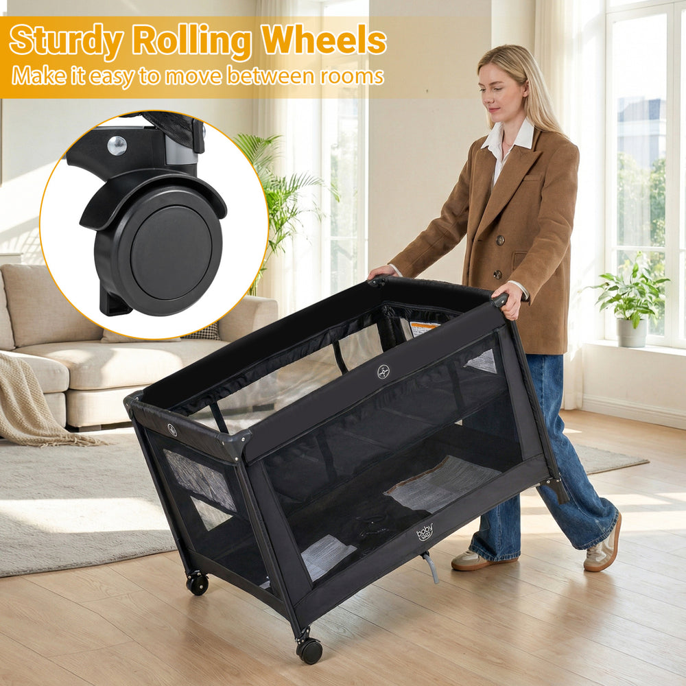 Portable baby playard in black with sturdy rolling wheels for easy movement, featuring breathable mesh and a soft.