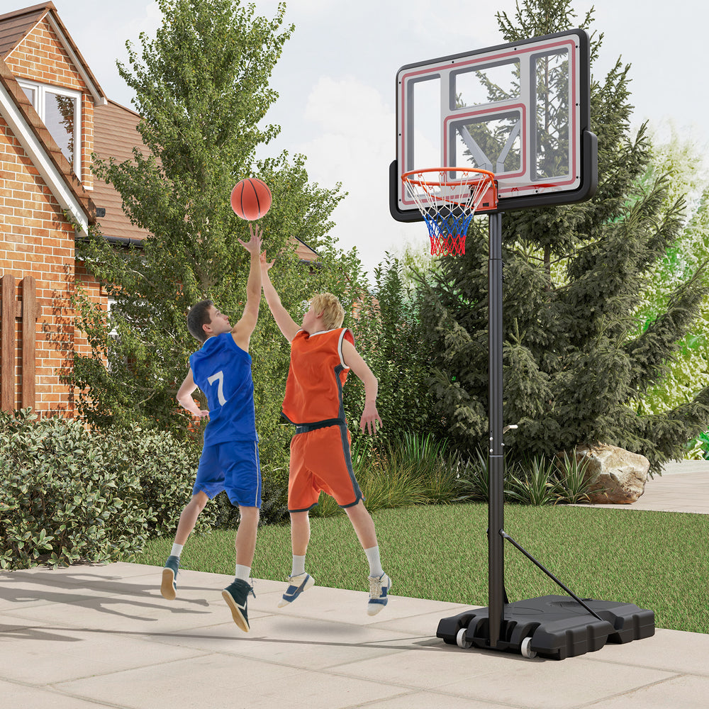 Two players shooting a basketball at a Portable Basketball Hoop adjustable from 7.4-10ft, ideal for outdoor play.