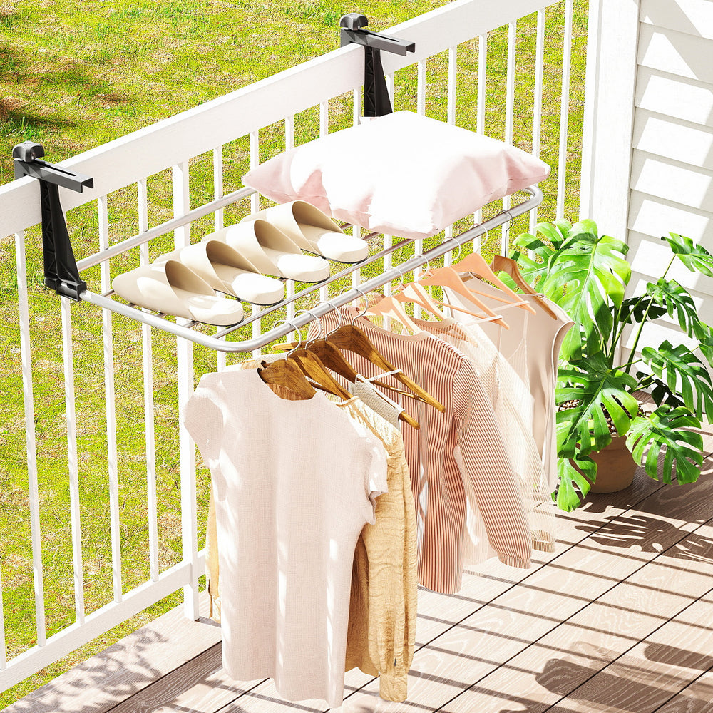 Portable aluminum clothes drying rack with adjustable brackets, featuring 7 bars for hanging items on a balcony.