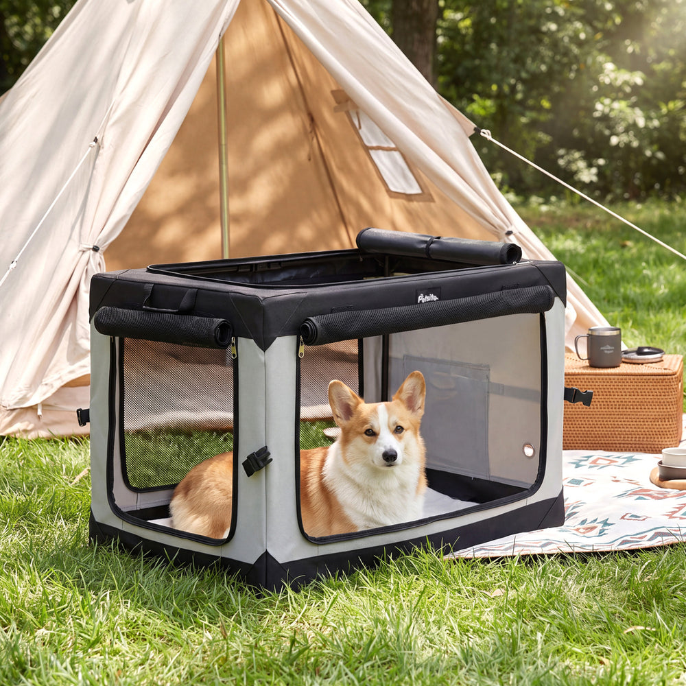 Portable collapsible soft dog crate with mesh doors and removable mat provides a comfortable space for pets outdoors.