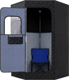 Portable far infrared sauna box in black with a chair inside, designed for home full body relaxation.