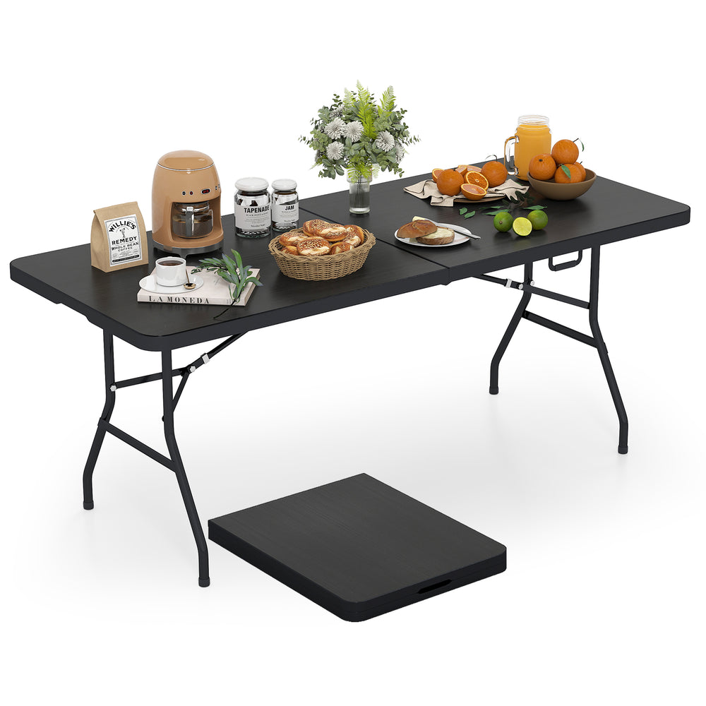 Portable folding camping table in black with food and drinks, ideal for picnics and outdoor gatherings.
