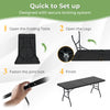 Portable folding camping table with a sturdy steel frame, designed for easy setup and stability, ideal for outdoor use.